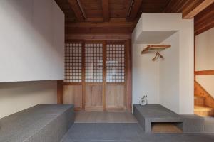 a room with stairs and a wooden door at The Korean Traditional Hanok in Downtown Seoul for convenient public transportation - Seoul Ari in Seoul