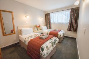 Postel nebo postele na pokoji v ubytování Strathern Motor Lodge