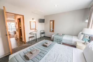 Postel nebo postele na pokoji v ubytování Strathern Motor Lodge