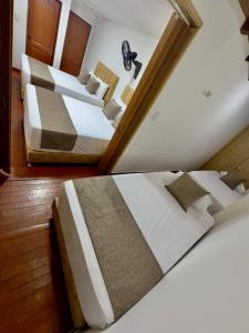 Voodi või voodid majutusasutuse Hotel Pereira Central toas