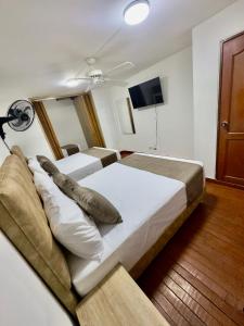 Voodi või voodid majutusasutuse Hotel Pereira Central toas
