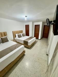 Voodi või voodid majutusasutuse Hotel Pereira Central toas