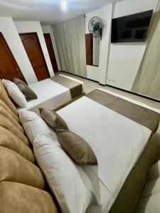 Voodi või voodid majutusasutuse Hotel Pereira Central toas