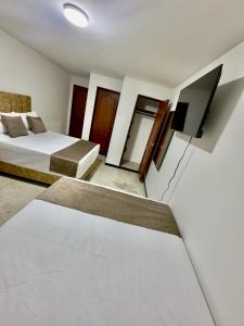 Voodi või voodid majutusasutuse Hotel Pereira Central toas