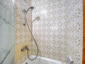 a bathroom with a shower with a shower head at Beachfront Apartment in Platja Almadrava in Montjoys +32 photos