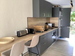 Η κουζίνα ή μικρή κουζίνα στο Studio 16 Vue mer Orient Beach