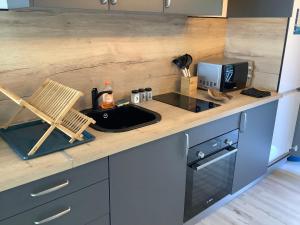 Η κουζίνα ή μικρή κουζίνα στο Studio 16 Vue mer Orient Beach