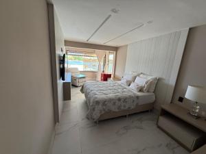 Ένα ή περισσότερα κρεβάτια σε δωμάτιο στο Casa píer só emoções +21 φωτογραφίες