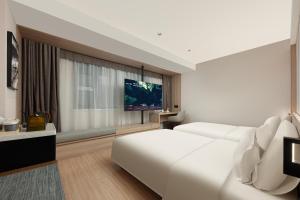 Μια τηλεόραση ή/και κέντρο ψυχαγωγίας στο Atour X Hotel Chengdu Taikoo Li General Office Wangfujing
