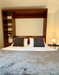 Postel nebo postele na pokoji v ubytování Apt Santiago Lastarria