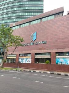 a building with a rock life centre sign on it at Hock Lee Hotel Residences - Anna 温馨公寓式的住宅 in Kuching