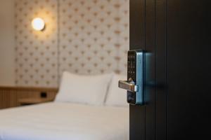 The Queens Gladstone客房内的一张或多张床位