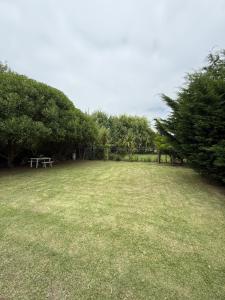 a park with a picnic table in the middle of a field at Casa Mar de Cobo in Mar de Cobo