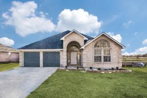 a large brick house with a garage at Rockwall Getaway for 6 in Rockwall