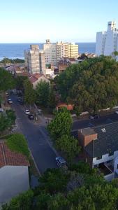 an aerial view of a city with the ocean at Amanecer mensajero in San Bernardo
