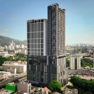 a tall building in a city with buildings at Iconic Regency Service Residences, managed by Iconic Hotel in Bayan Lepas