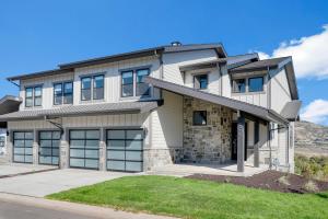 a house with a mountain in the background at Luxury Stays Club, New lovely 5br TH, New Deer Valley 1 min Park City 10 min in Heber City