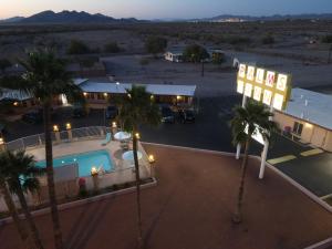 an aerial view of a hotel with a pool and palm trees at Palms Inn in Gila Bend