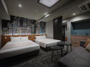 Ένα ή περισσότερα κρεβάτια σε δωμάτιο στο MONday Apart Premium OSAKA NAMBA WEST +65 φωτογραφίες