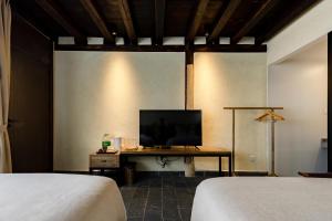 Postel nebo postele na pokoji v ubytování Kunming Mountain Wowo Hefeng Dieyuan B&B