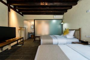 Postel nebo postele na pokoji v ubytování Kunming Mountain Wowo Hefeng Dieyuan B&B