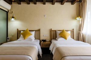 Postel nebo postele na pokoji v ubytování Kunming Mountain Wowo Hefeng Dieyuan B&B