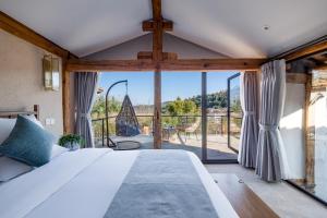 Postel nebo postele na pokoji v ubytování Kunming Mountain Wowo Hefeng Dieyuan B&B