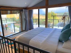 Postel nebo postele na pokoji v ubytování Kunming Mountain Wowo Hefeng Dieyuan B&B