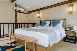 Postel nebo postele na pokoji v ubytování Kunming Mountain Wowo Hefeng Dieyuan B&B