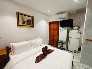 Cama o camas de una habitación en Happy stay villa