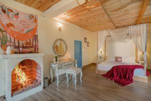 a bedroom with a fireplace and a bed and a mirror at SaffronStays Fairytale Villa - 3 bedroom villa in orchards and access to the river in Gushaini +62 photos