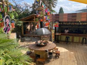 an outdoor patio with a table and a bar at Hello Sapa 2 in Sa Pa +15 photos