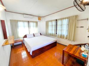 Ένα ή περισσότερα κρεβάτια σε δωμάτιο στο Sabaydee Guesthouse