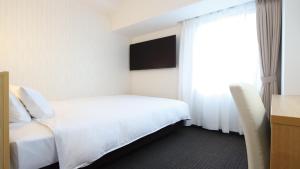 Katil atau katil-katil dalam bilik di AB Hotel Kani