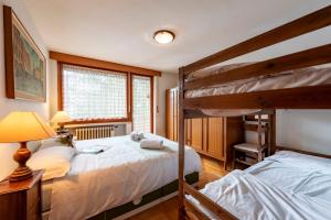 Ένα ή περισσότερα κρεβάτια σε δωμάτιο στο Residence Dolonne - Happy Rentals +24 φωτογραφίες