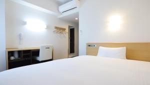Katil atau katil-katil dalam bilik di AB Hotel Kani