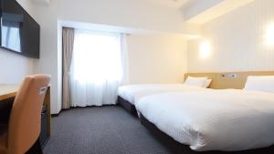 Katil atau katil-katil dalam bilik di AB Hotel Kani