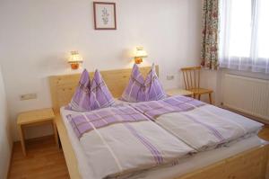 Postel nebo postele na pokoji v ubytování Haus Gsenger + 1 fotografie
