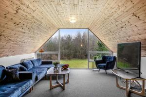A seating area at Large Pool House For 20 People, Where Hunting Is Allowed In The Adjacent Forest,