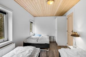 A bed or beds in a room at Large Pool House For 20 People, Where Hunting Is Allowed In The Adjacent Forest,