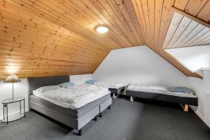 A bed or beds in a room at Large Pool House For 20 People, Where Hunting Is Allowed In The Adjacent Forest,