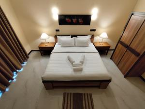 Postel nebo postele na pokoji v ubytování Villa Infinity Negombo