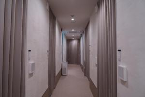 Fotografie z fotogalerie ubytování HOTEL minimumms女性専用カプセルホテルWomen only hotel v destinaci Naha
