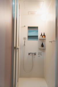 Koupelna v ubytování HOTEL minimumms女性専用カプセルホテルWomen only hotel