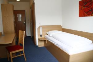 Postel nebo postele na pokoji v ubytování G&K Hotel