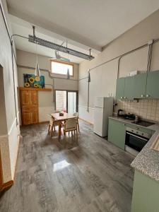 a large kitchen with a table and a tableasteryasteryasteryasteryasteryasteryastery at Sunflower 2bedroom Flat North Nicosia-Turkish Side in Nicosia