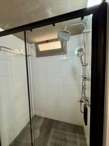 a bathroom with a shower with a glass door at Sunflower 2bedroom Flat North Nicosia-Turkish Side in Nicosia +8 photos