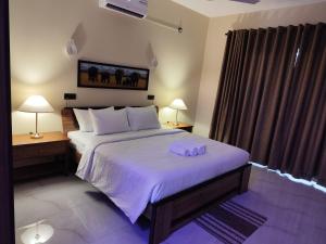 Postel nebo postele na pokoji v ubytování Villa Infinity Negombo