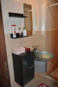a bathroom with a sink and a toilet and a mirror at Rabat Appartement Agdal in Rabat