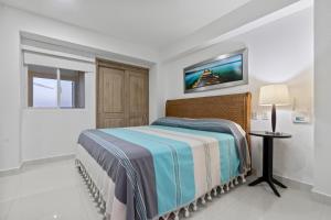 Ένα ή περισσότερα κρεβάτια σε δωμάτιο στο SeaFront Residence - Puerto Vallarta